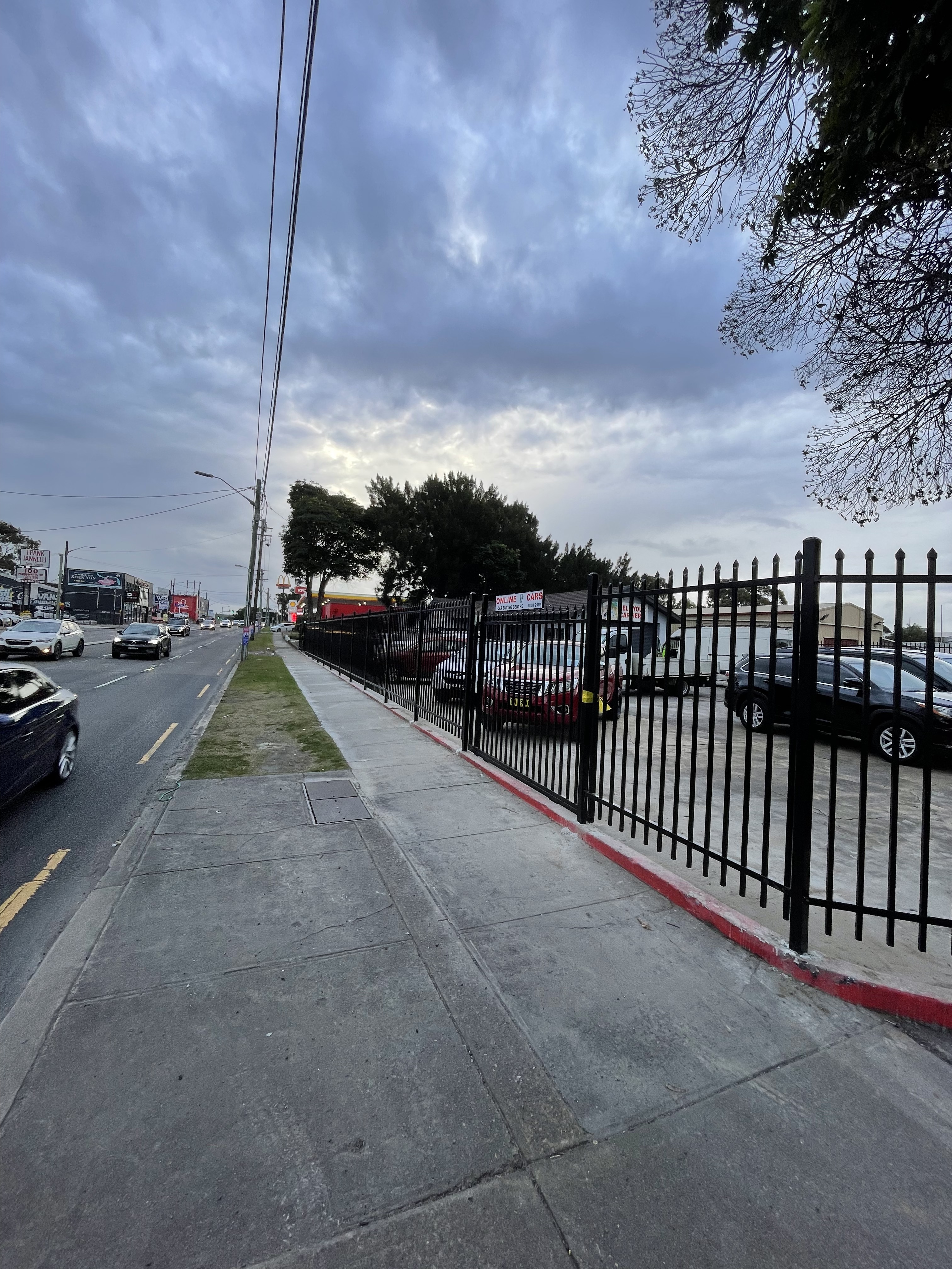 Black steel security fencing along commercial street frontage