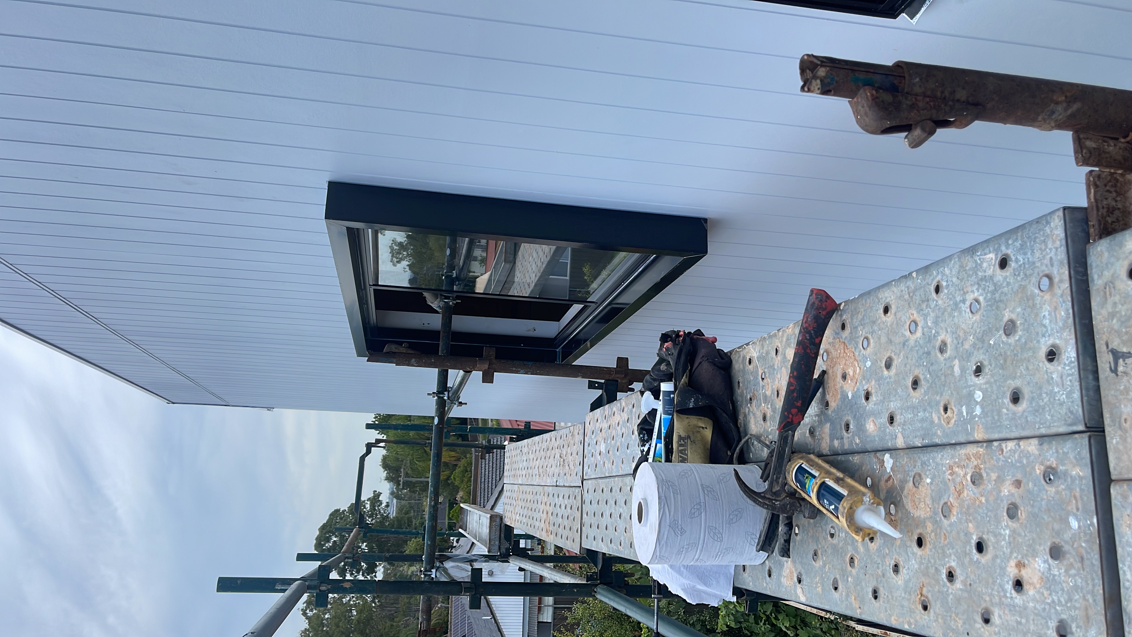 Window installation on scaffolding