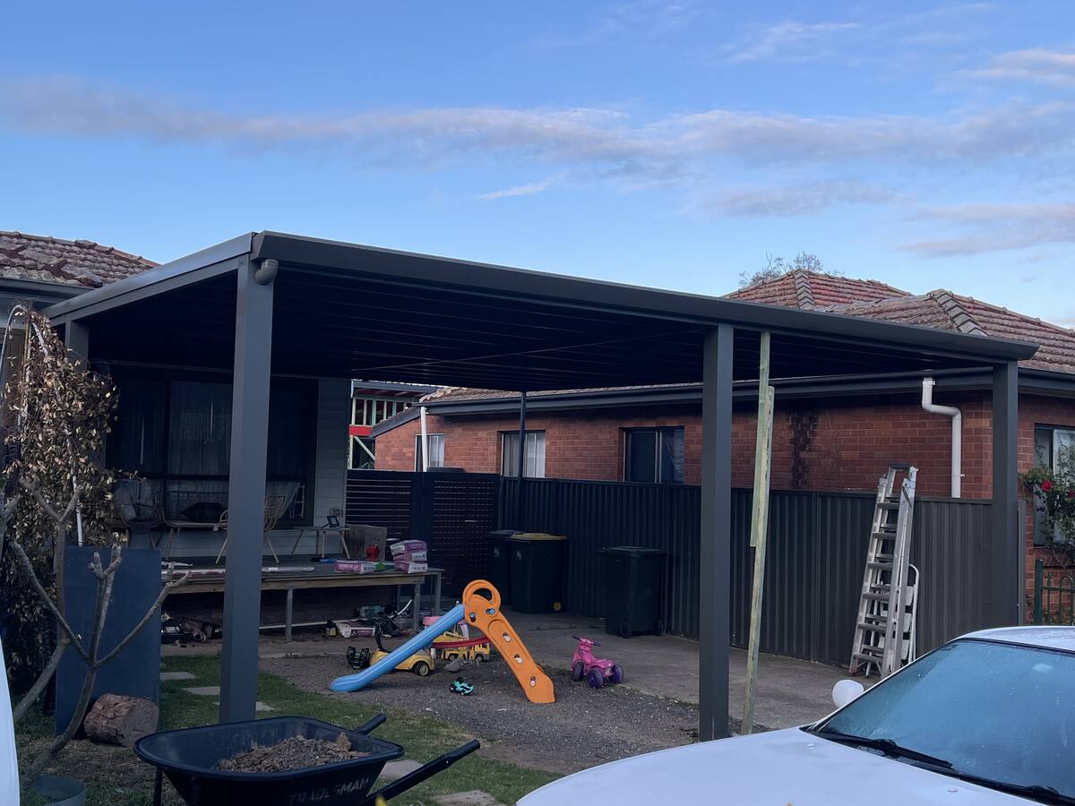 Dark charcoal flat roof carport
